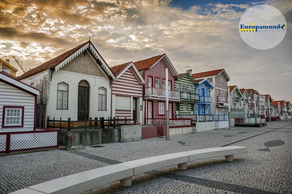 Costa Nova do Prado ( Portugal) famous home Palheiros with their houses with colorful stripes derived from original wooden houses of fishermen, famous as home Palheiros. Evening.